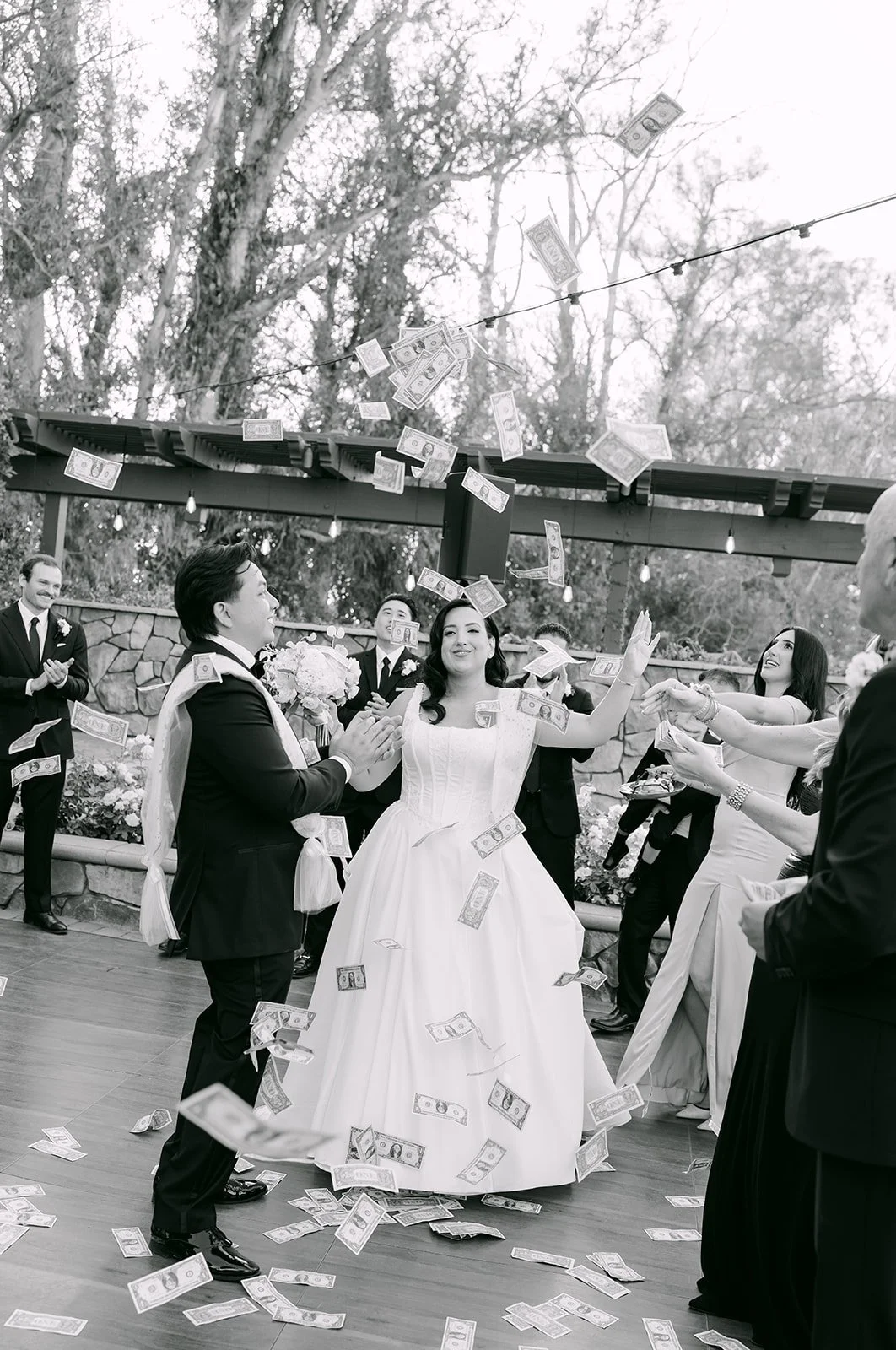 Black and white photo of the money dance during the grand entrance