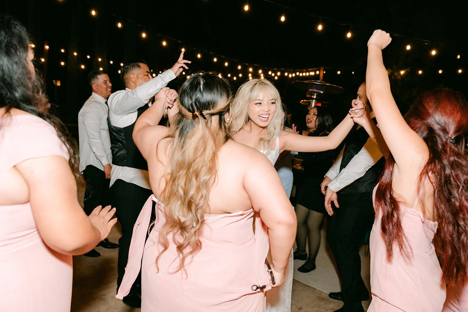 Konitha and friends with hands in the air