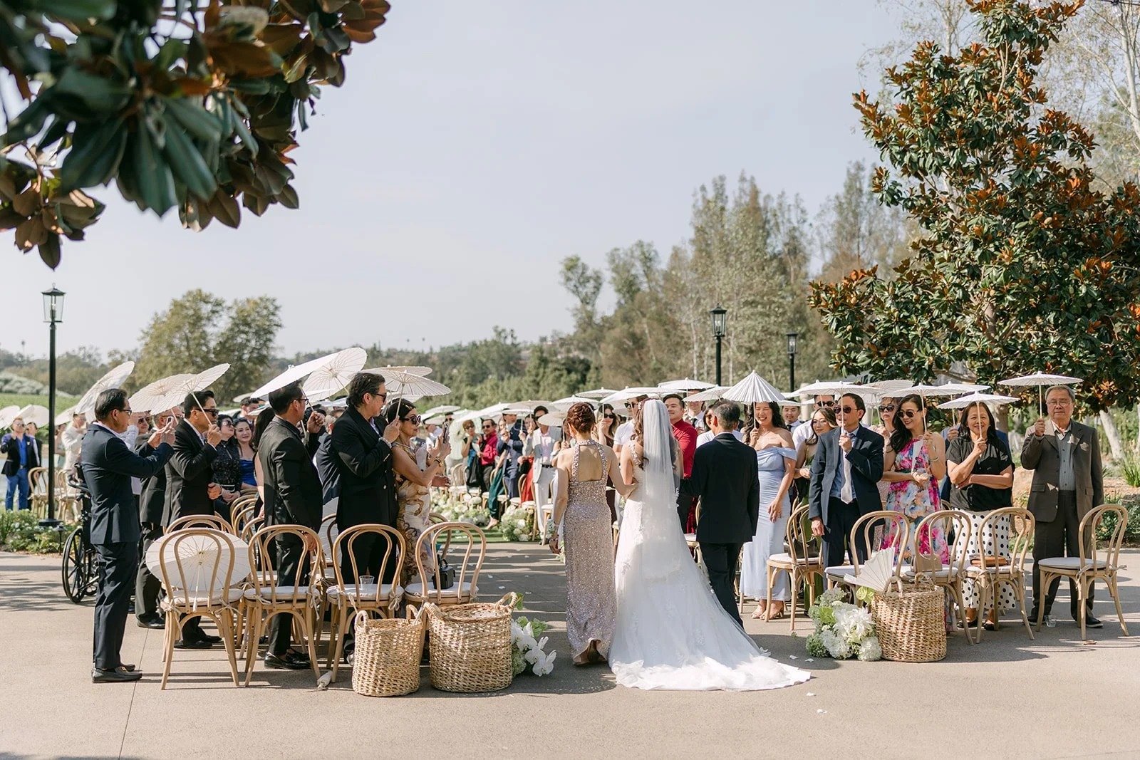 Marina walking down the aisle at the Monte Bella pond ceremony