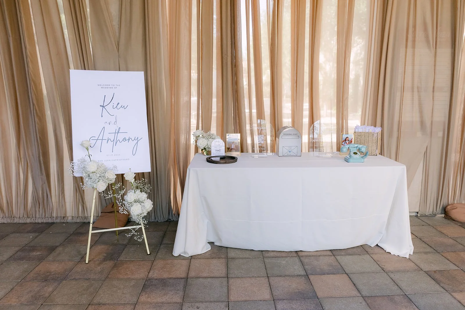 Welcome sign and guest table in front of the drapery
