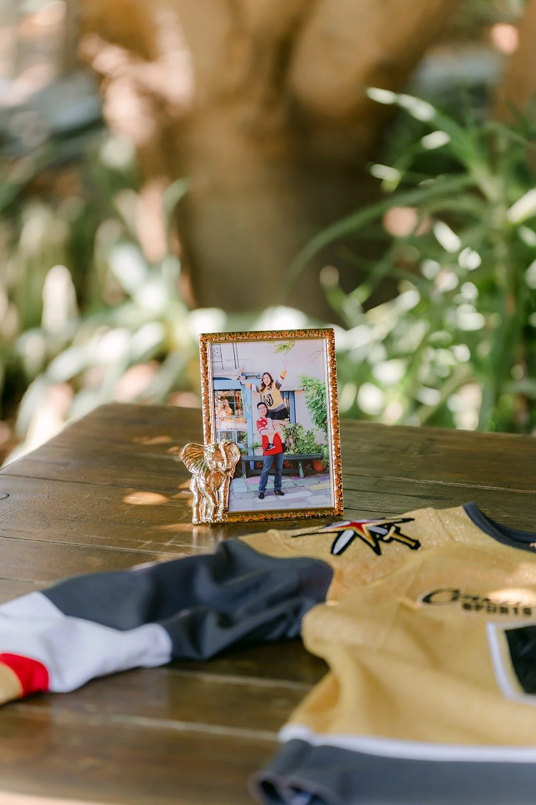 A framed photo of the couple on the jersey guestbook table