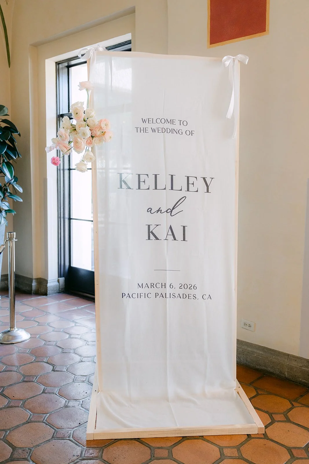 Kelley and Kai welcome sign at the reception entrance