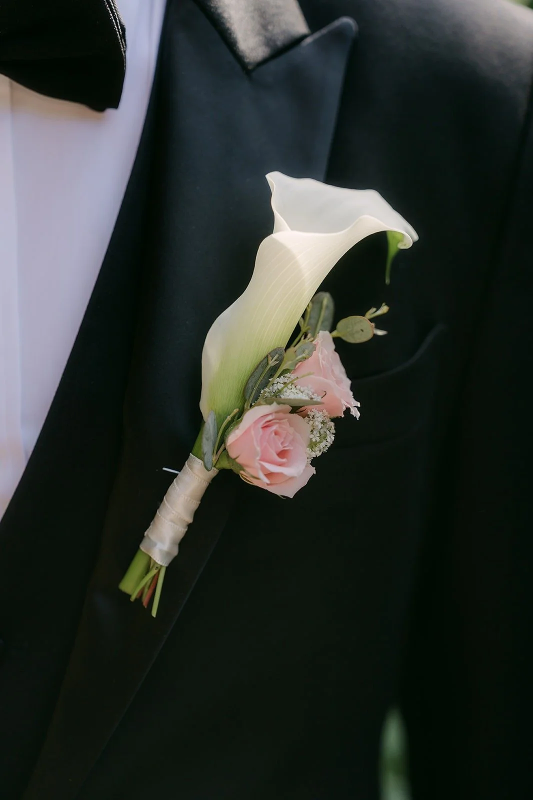 Close up of Eunsang's calla lily boutonniere