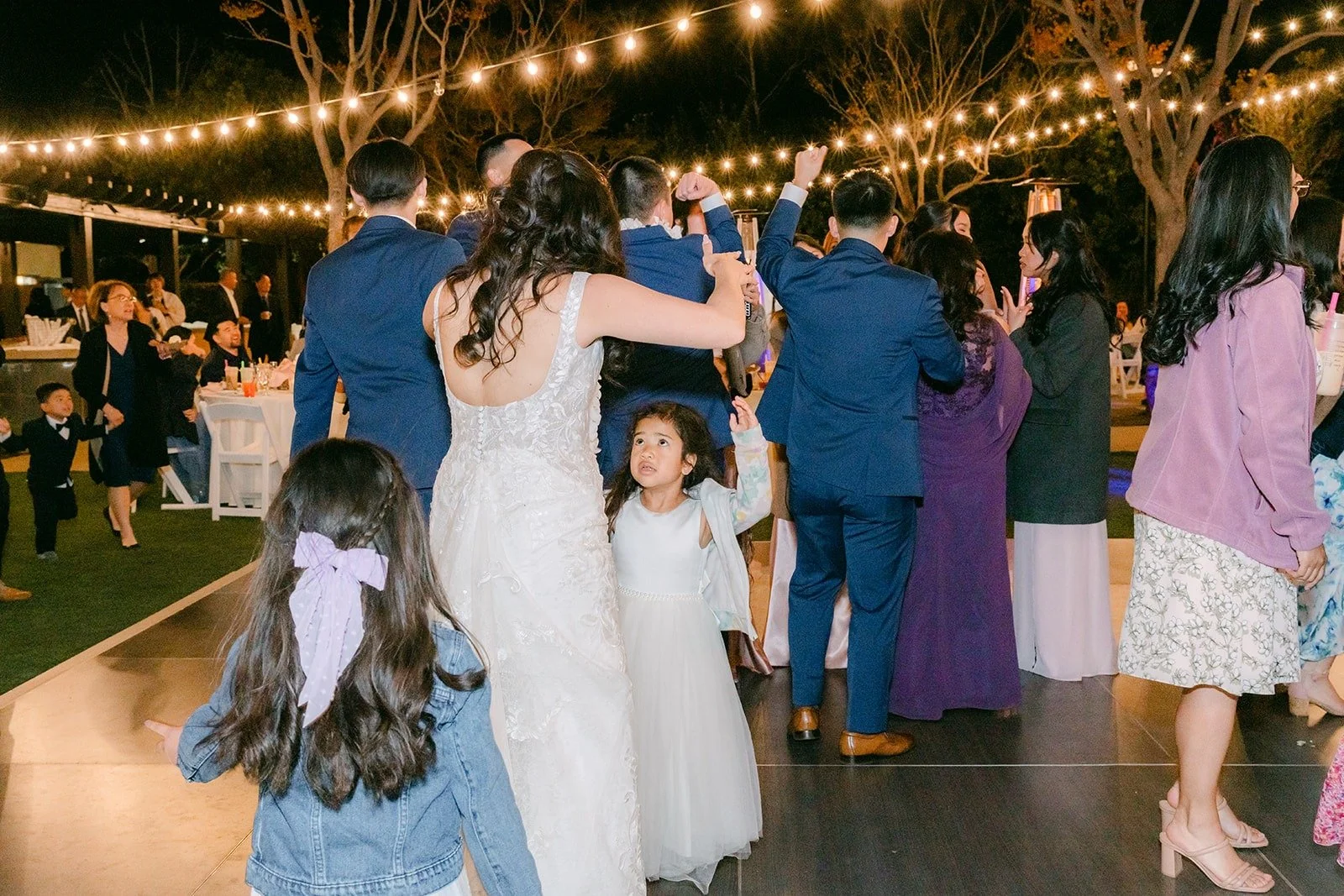 Kelli and Alex dancing in the middle of a full dance floor