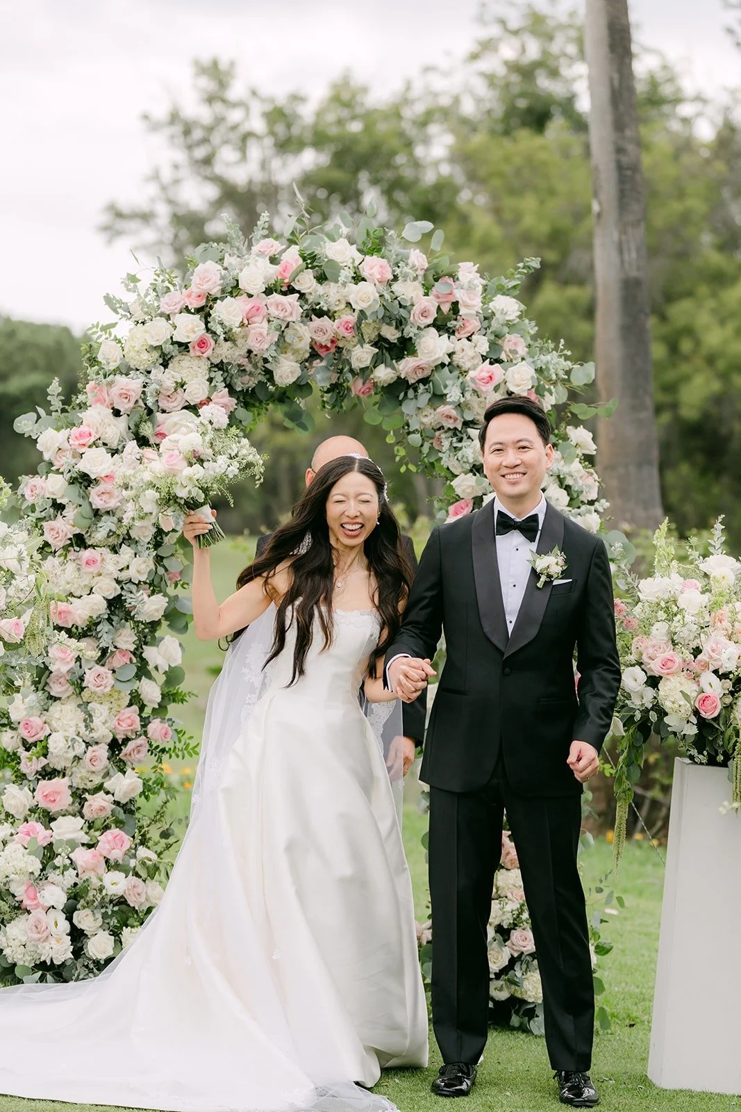 Kristine and William beaming as they head back up the aisle