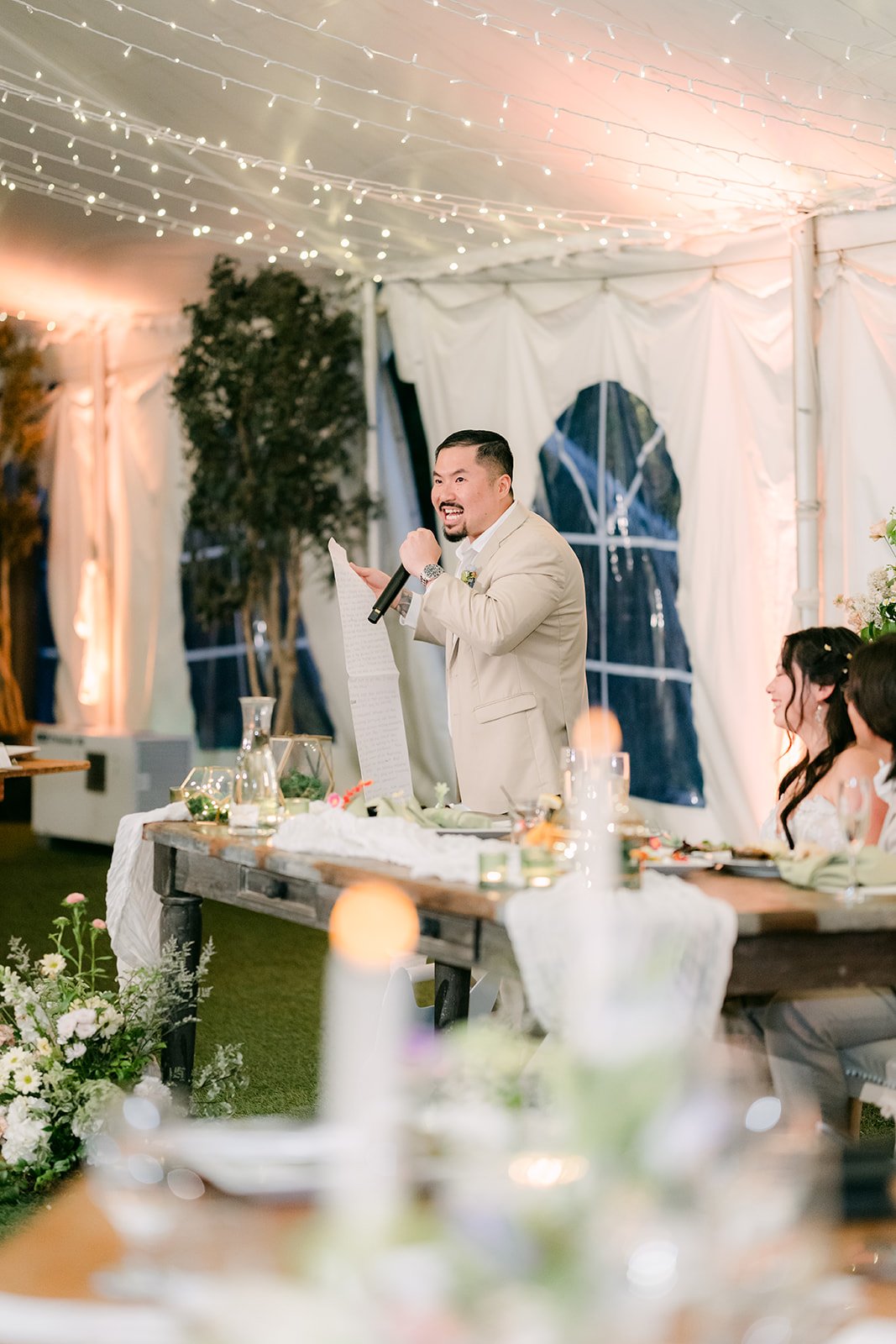 Groomsman giving a toast at the reception