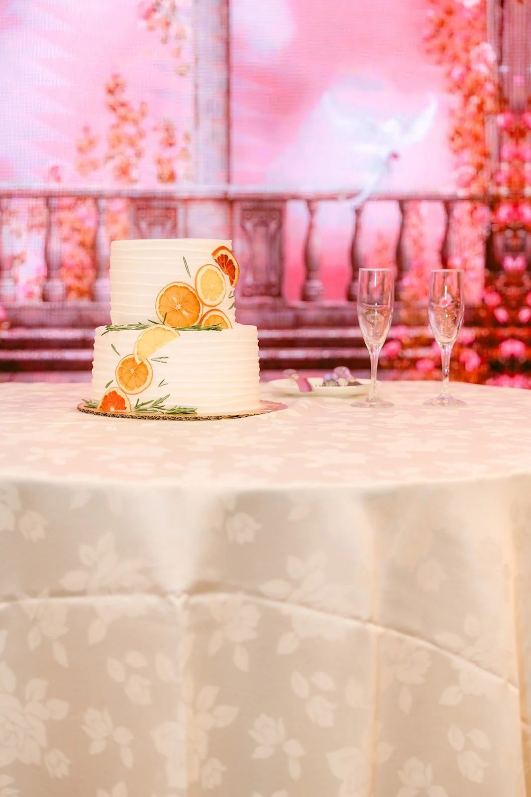 Shayna and Robert's two tier cake with orange and white florals