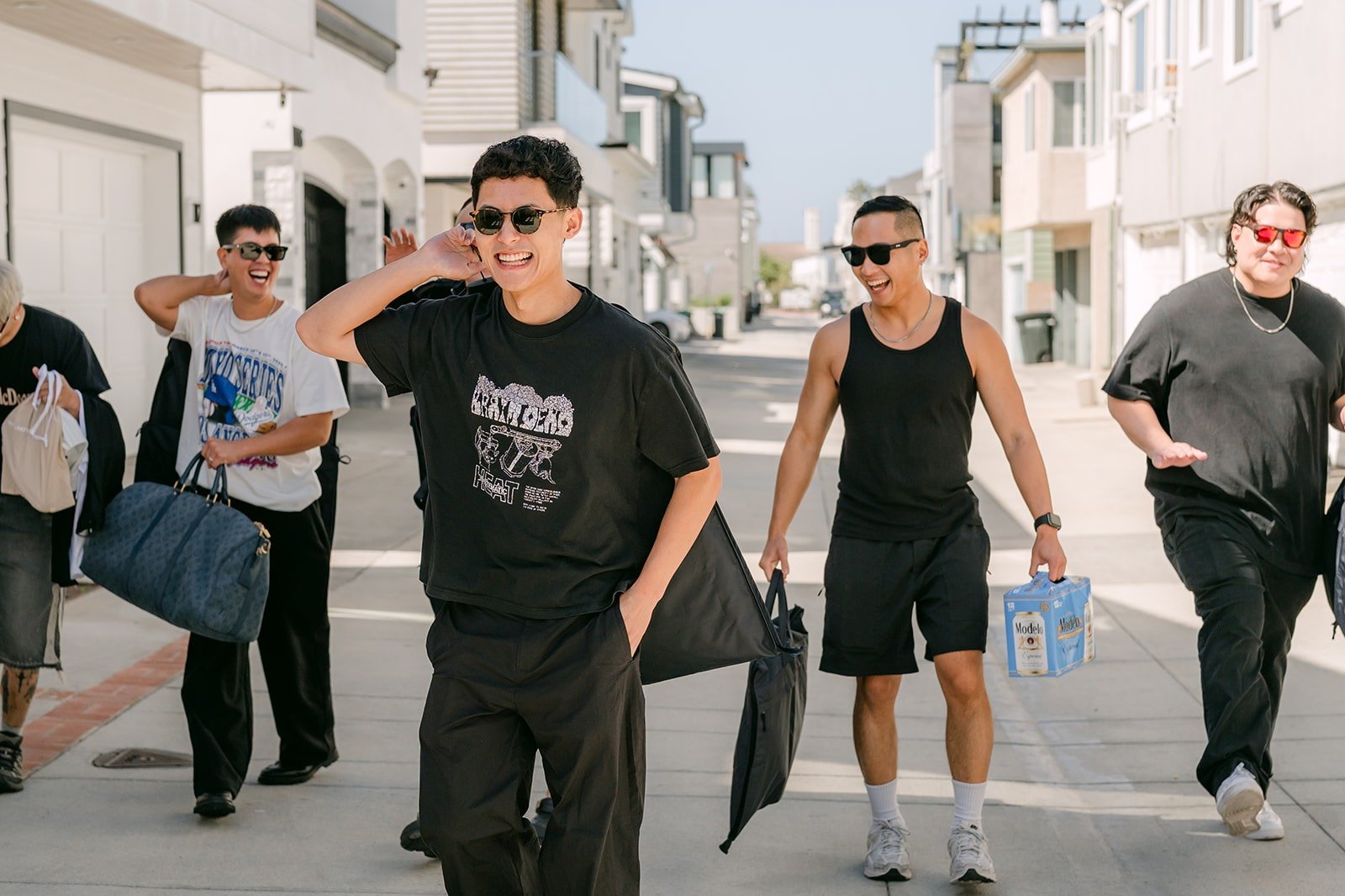 The groomsmen striking a pose on the street before heading to The Harper