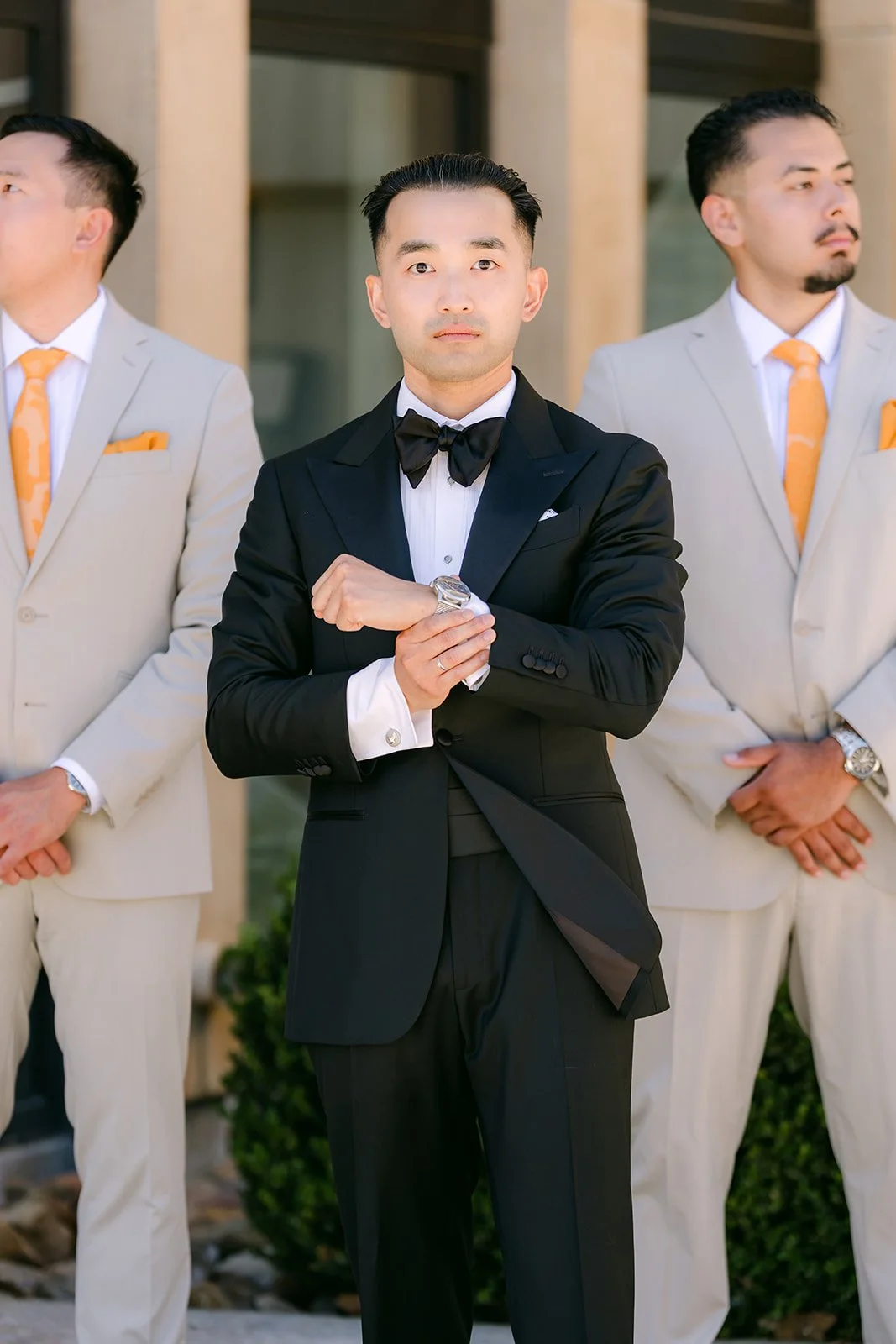 Vincent with his groomsmen in tan suits