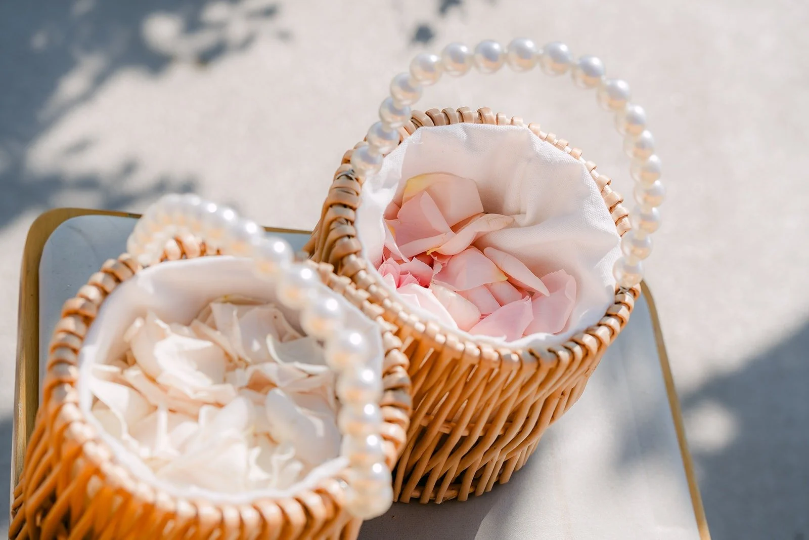 Woven baskets of petals waiting for the flower girls