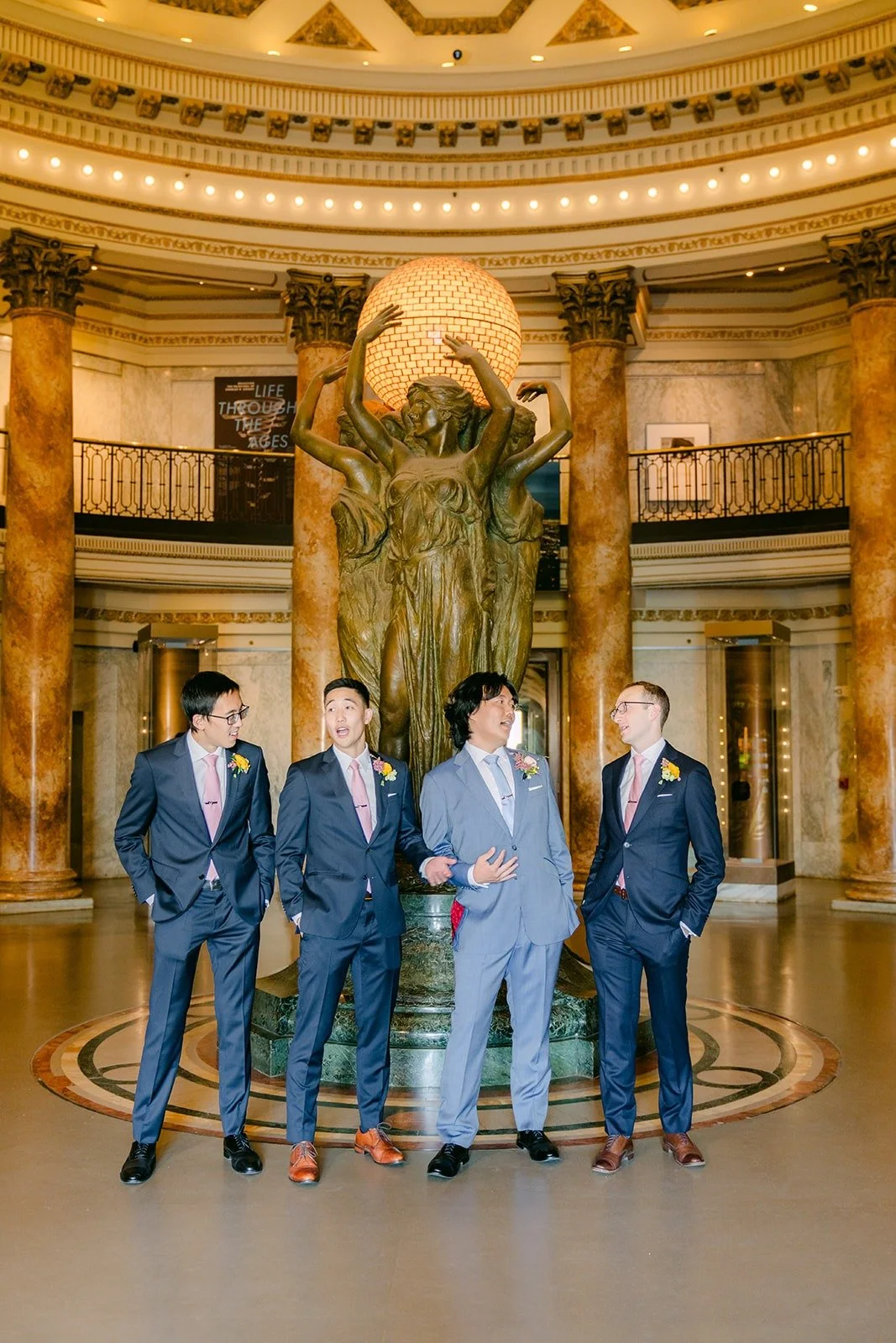 Philip and his groomsmen under the dome of the Rotunda