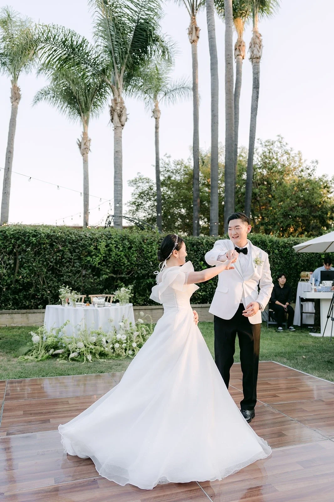 Amy and Sam's first dance under the palms at the Muckenthaler