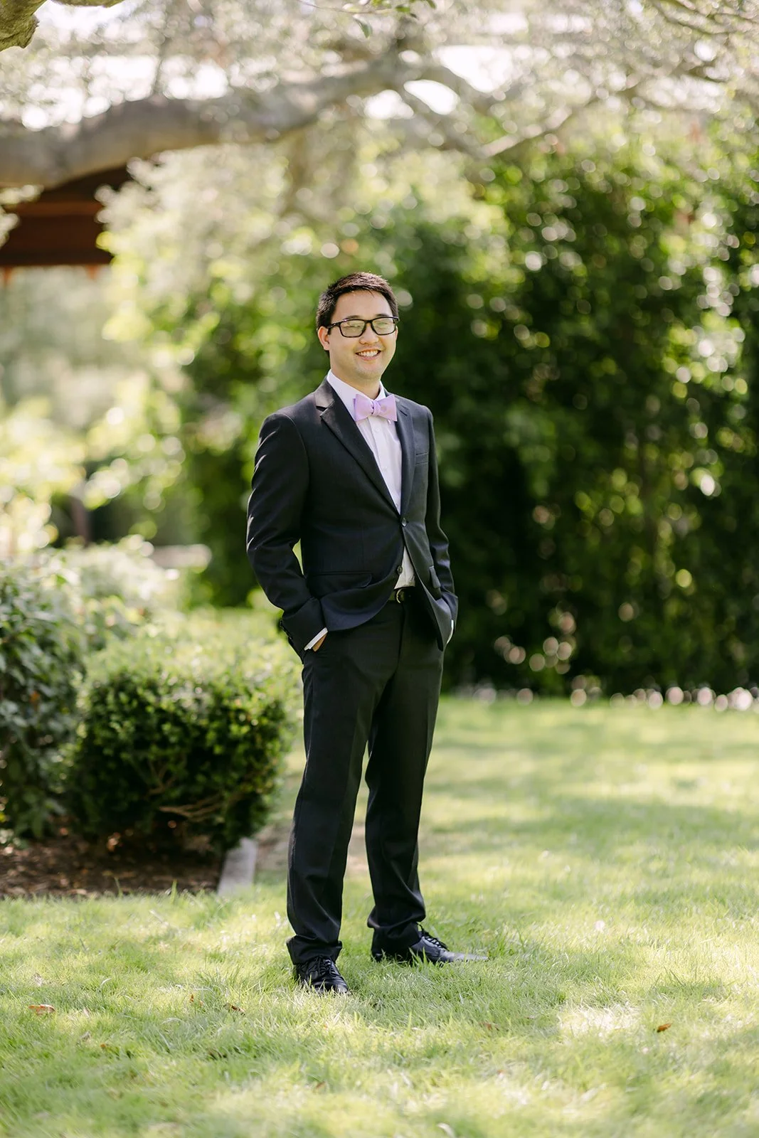 Patrick in his suit and lavender bow tie