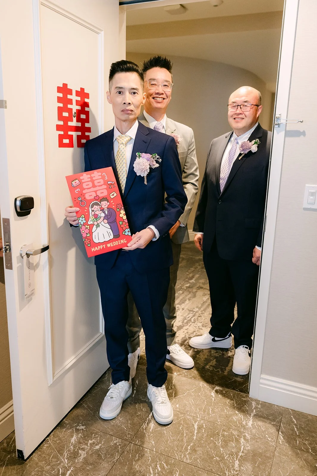 Bobby holding a red envelope during the door games.
