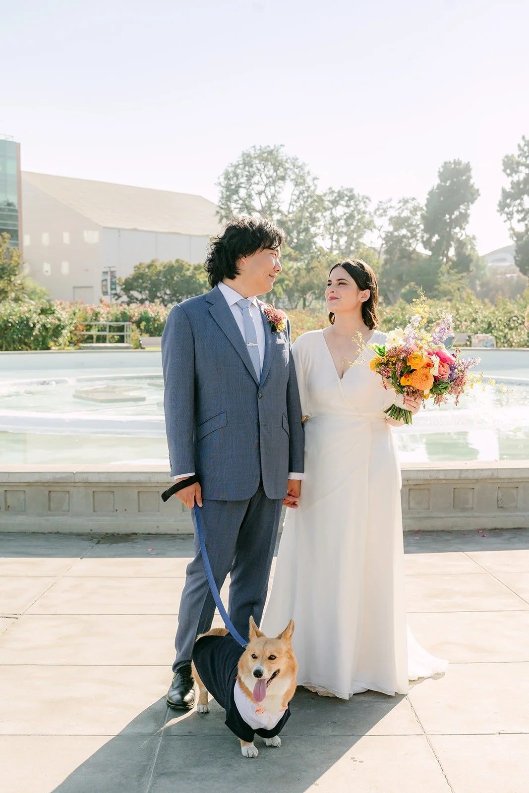 Jessie and Philip together by the fountain with Pumpkin at their feet