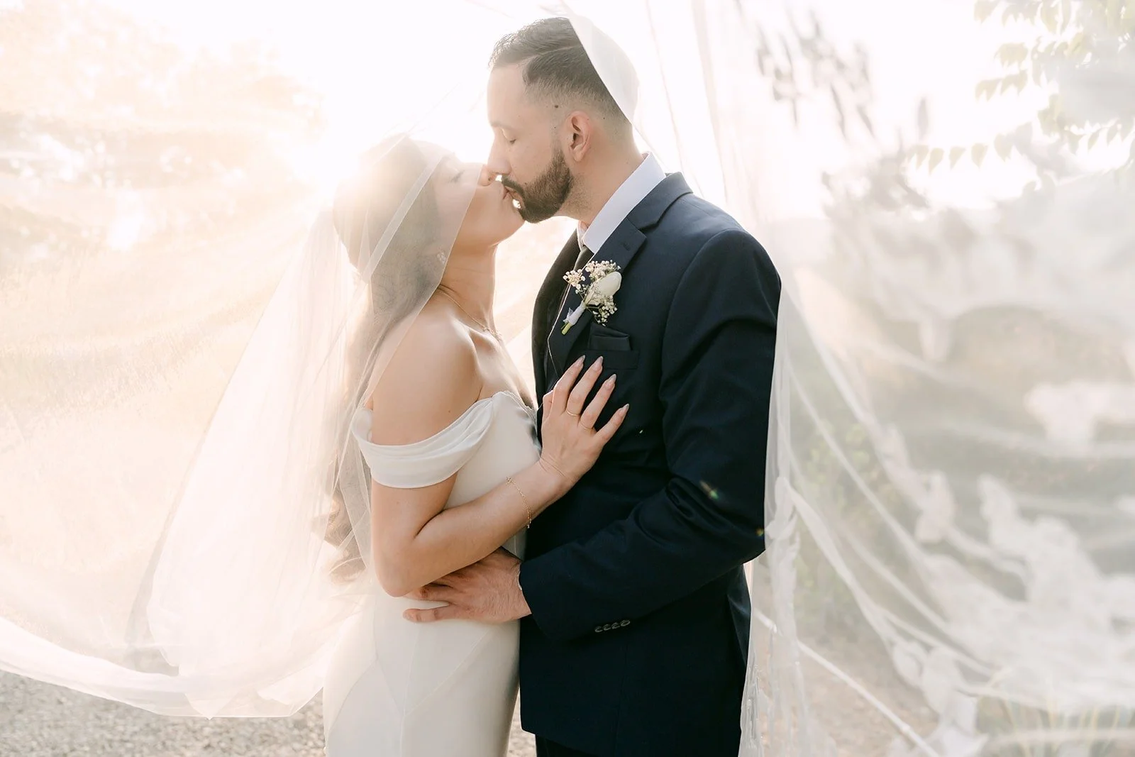 Danny kissing Mariana's forehead under her glowing veil at Padua Hills Theatre