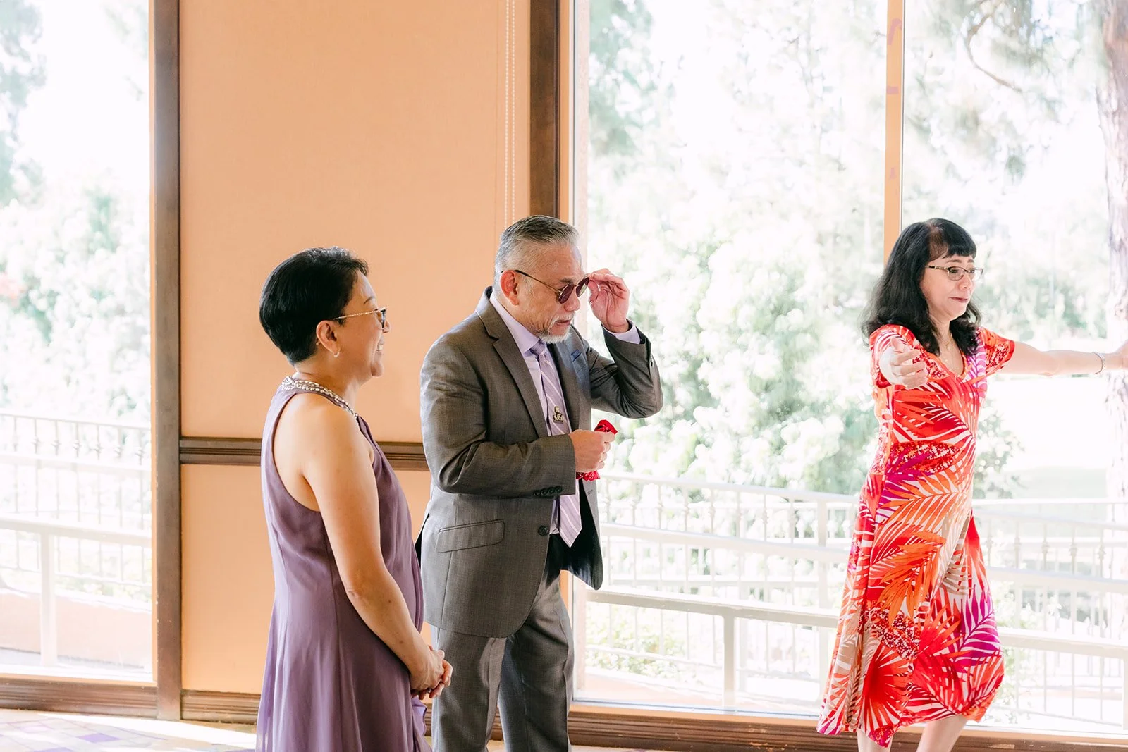 Angela's godparents reacting to her gown