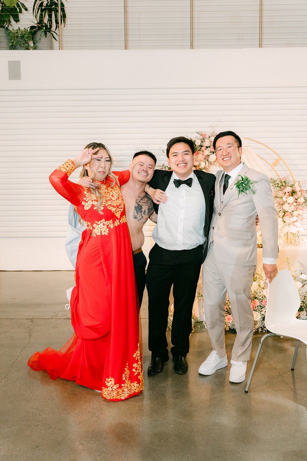 Couple with a guest on the reception dance floor