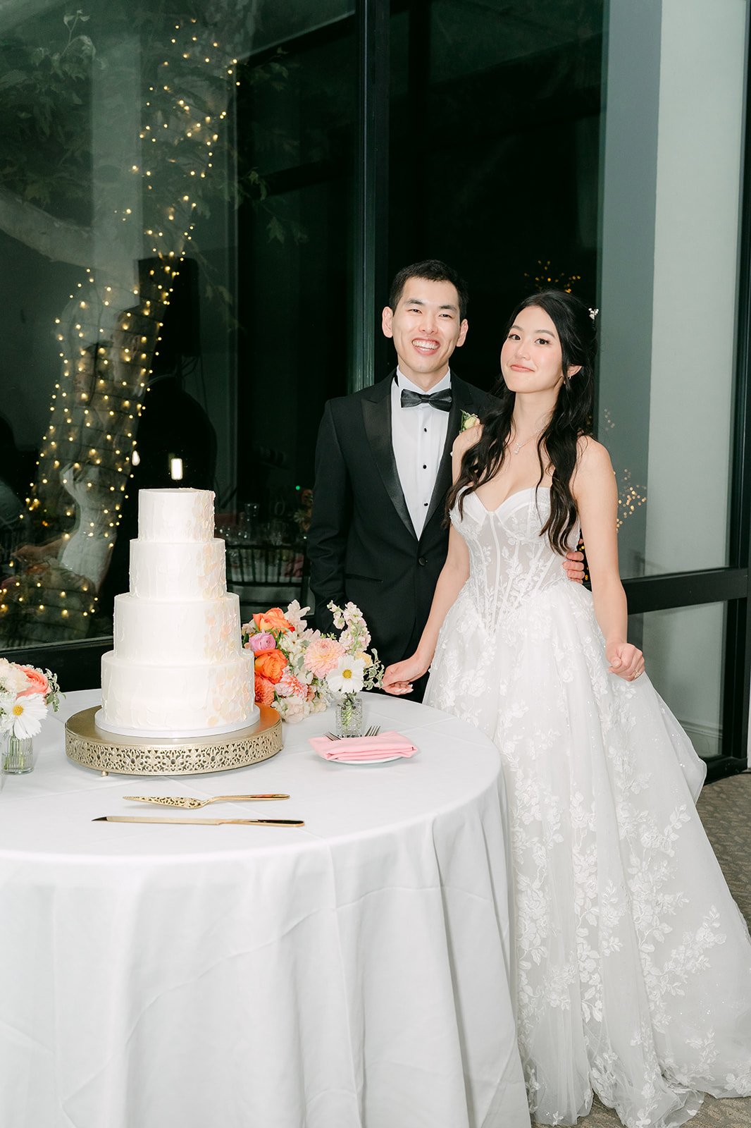 Clarissa and Austin beside their cake