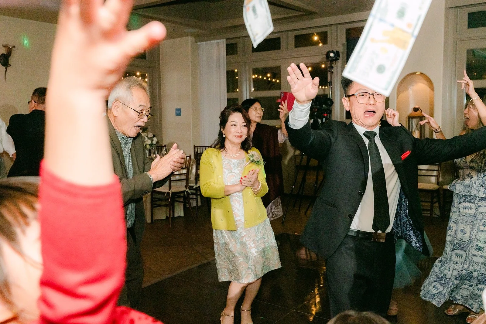 Xuemin dancing in her red gown under the ballroom lights