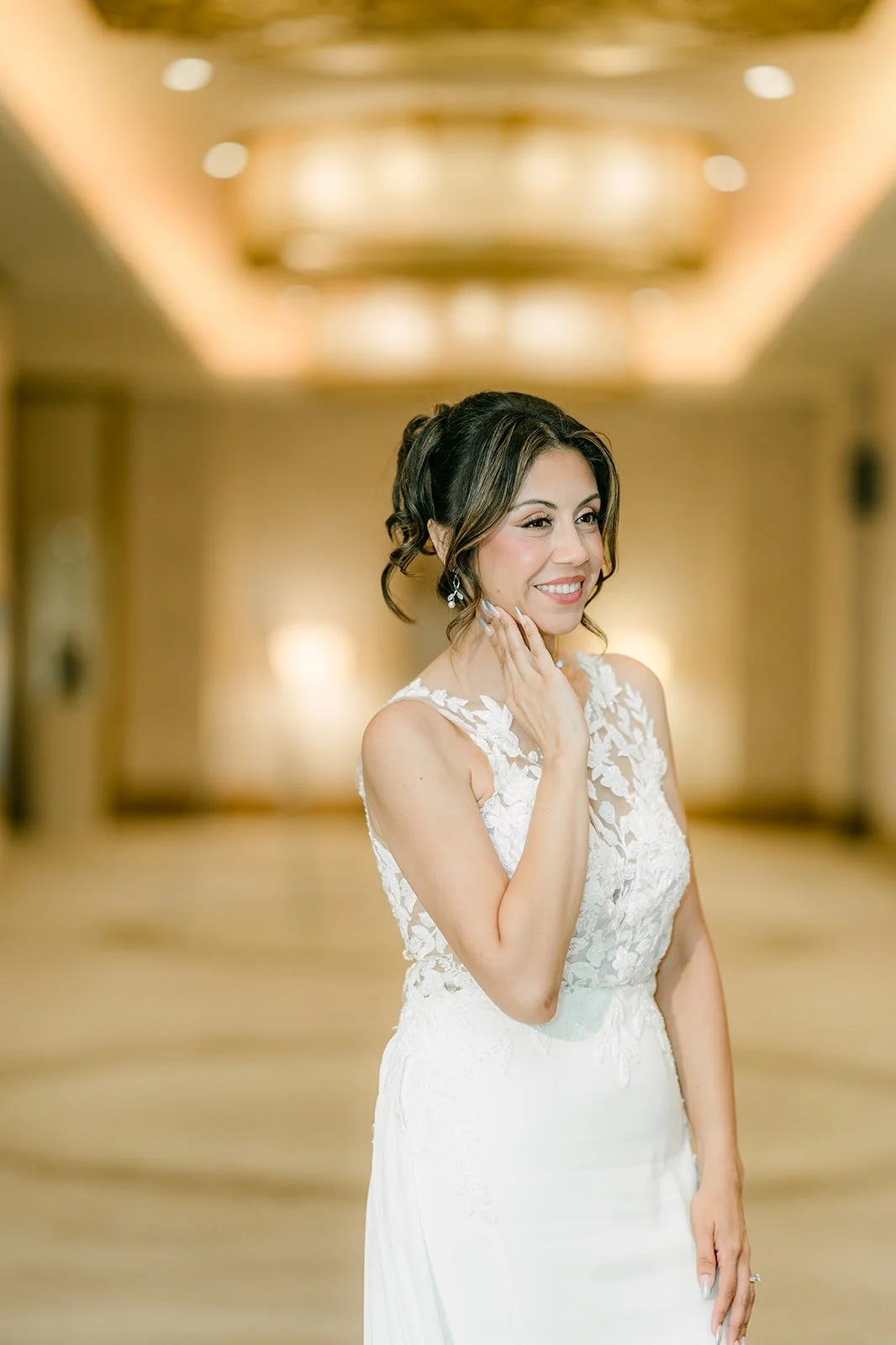 Francesca in a hallway at The Westin Anaheim Resort, ready for the church, photographed by One and Only Production