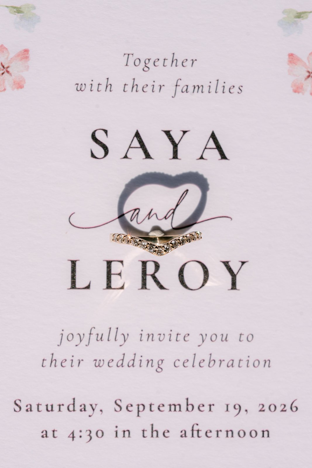A close-up of the watercolor invitation suite