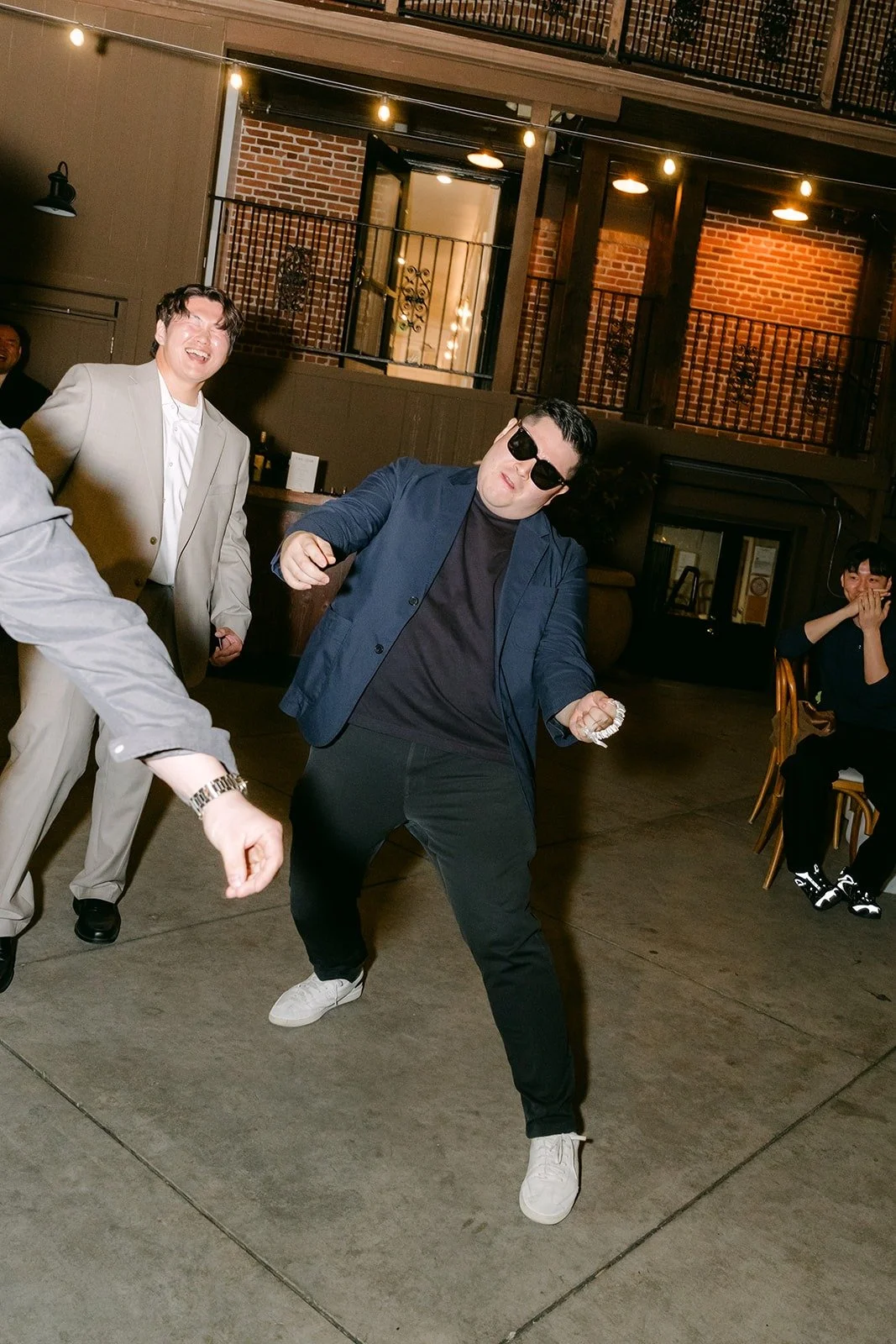 A guest in sunglasses showing off his moves