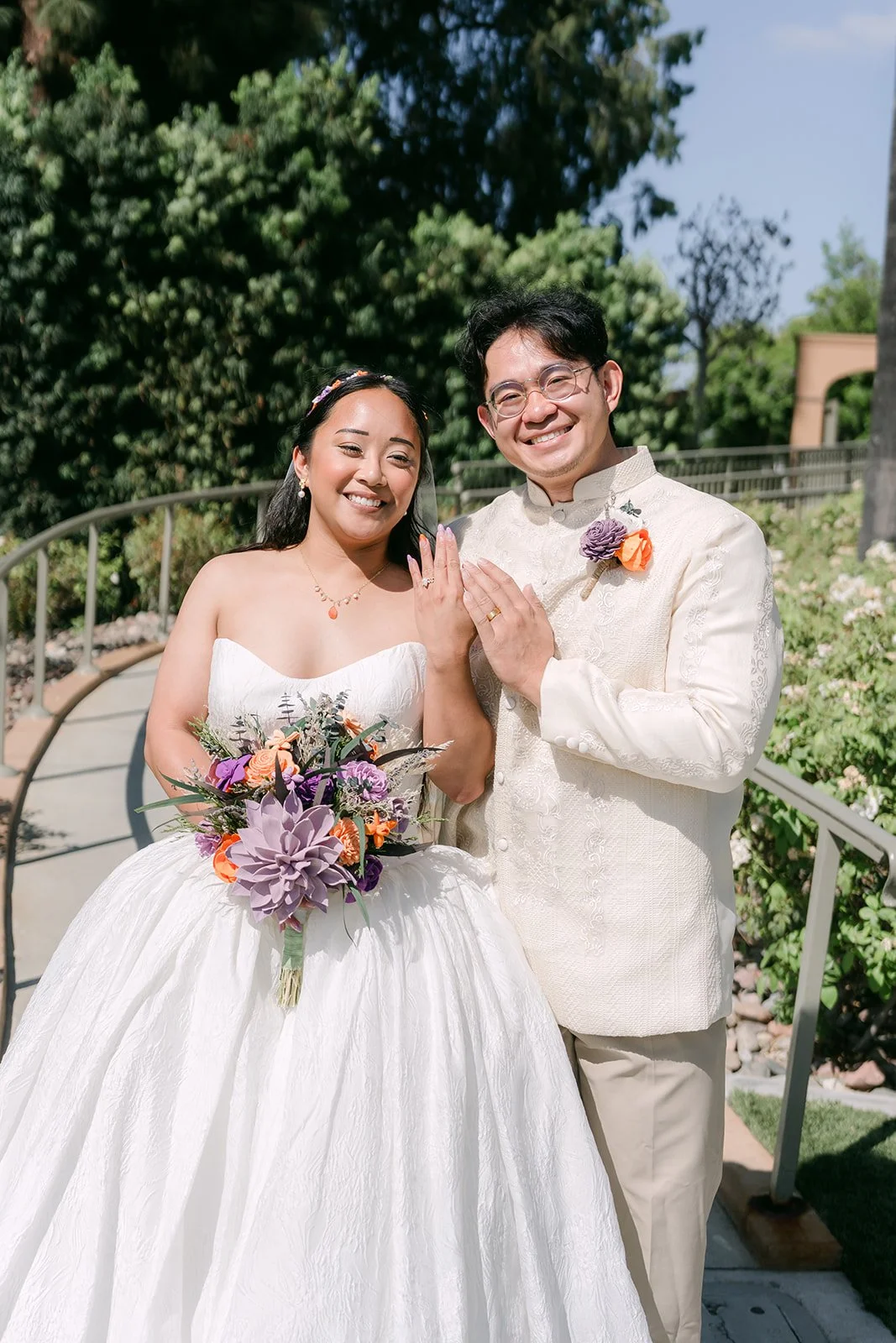 Angela and Jacob cheering as newlyweds