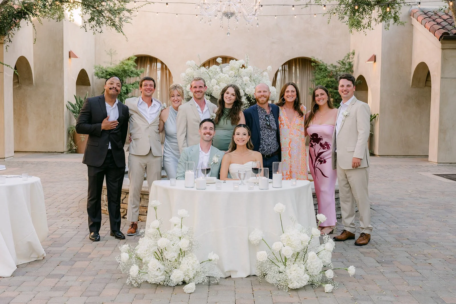 Guests gathered at a reception table for a group photo