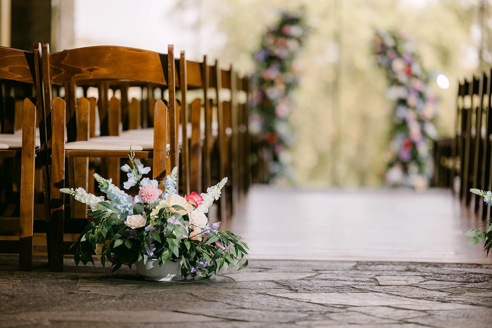 Pastel florals lining the aisle