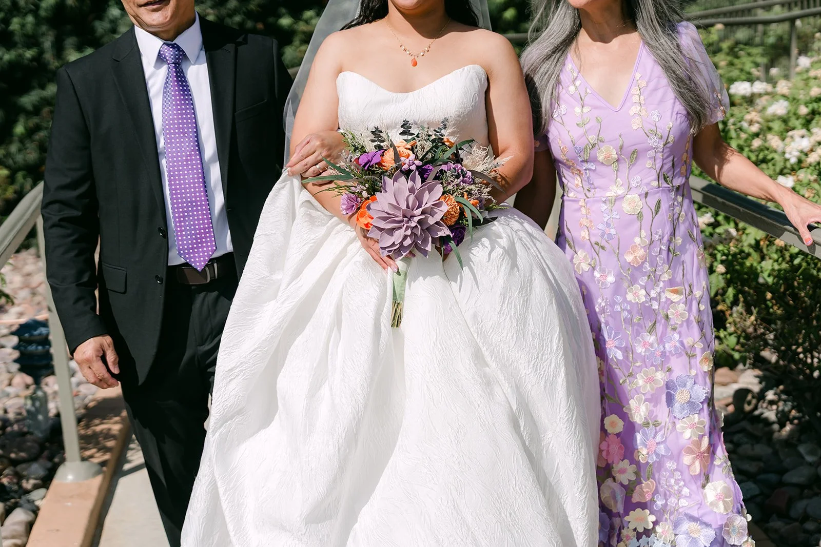 Angela walking with her parents