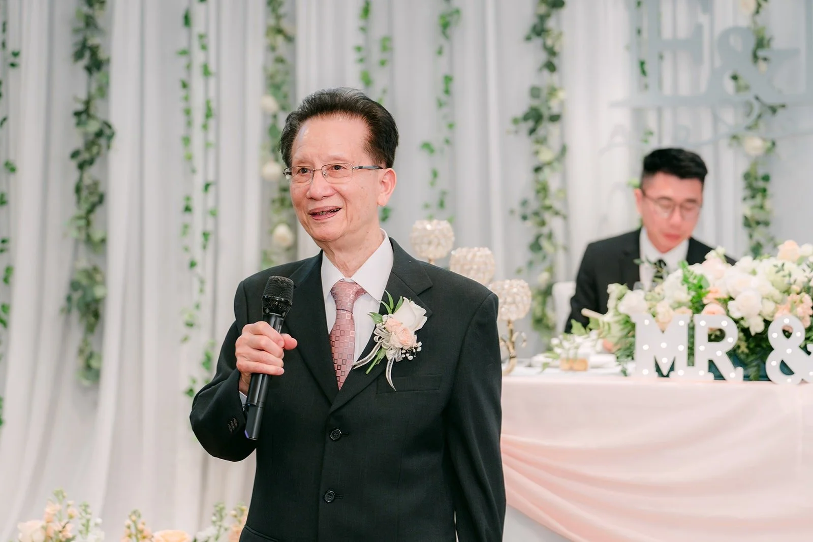 A family member gives a toast at the reception