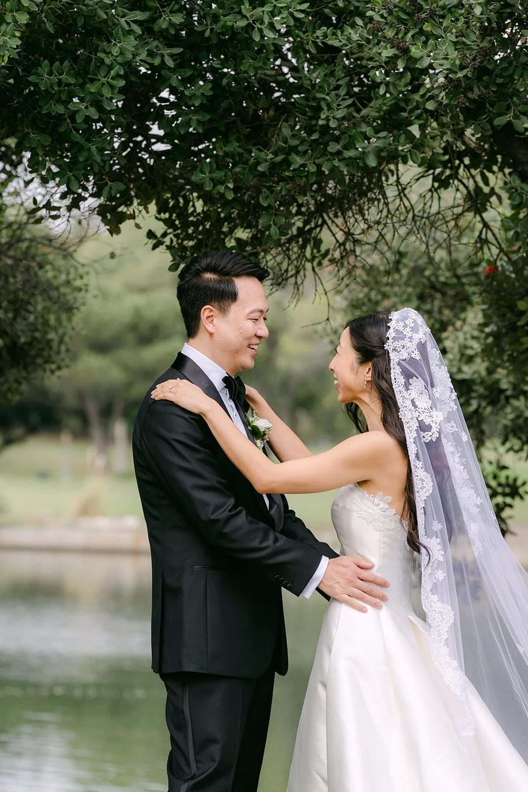Kristine and William smiling at each other after the first look