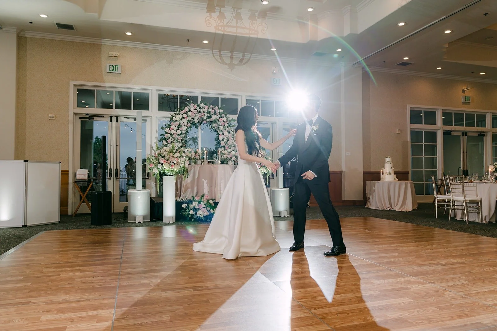 Kristine and William's first dance in a wide view of the ballroom