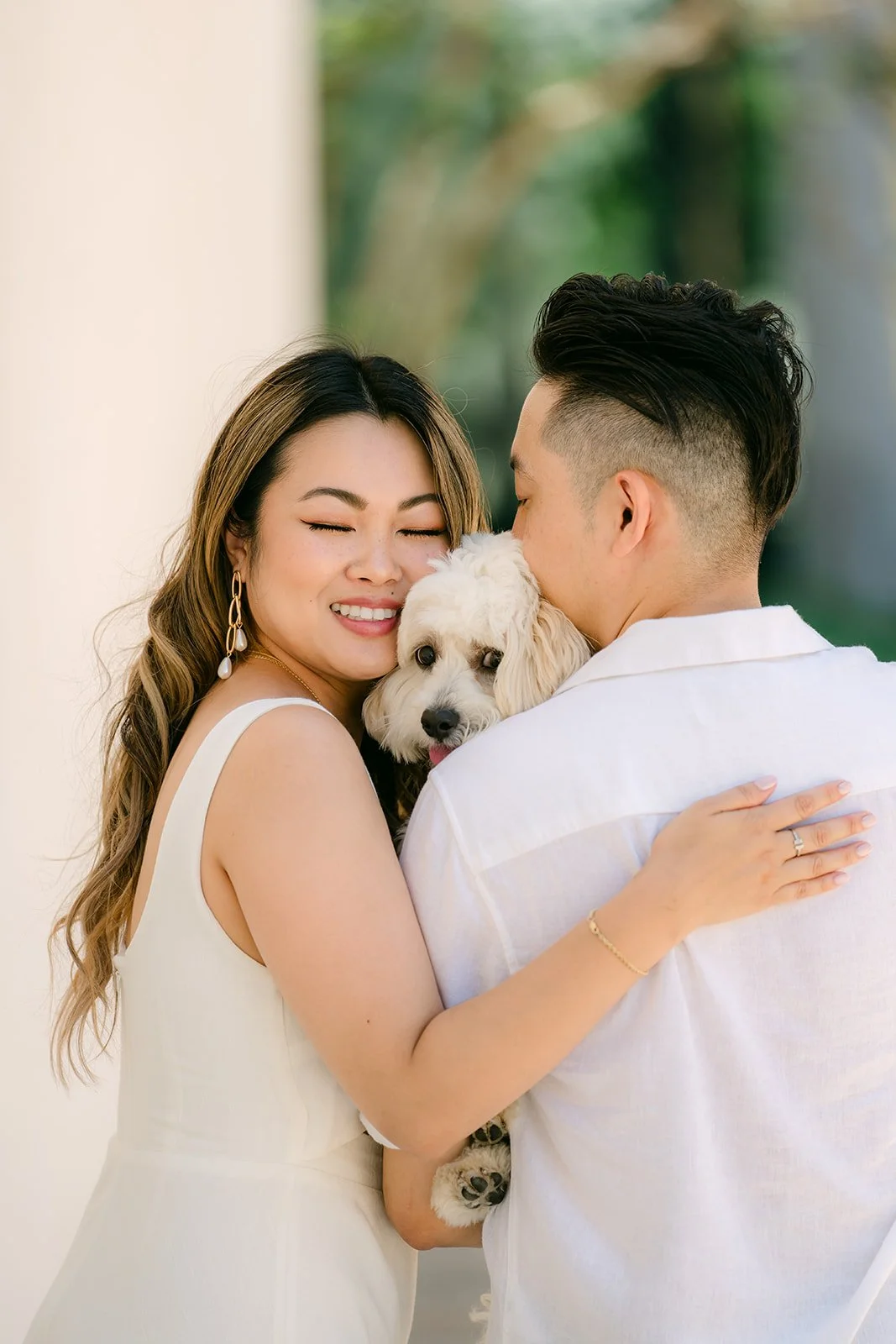 Stephanie hugs Alan as Tofu peeks over his shoulder.