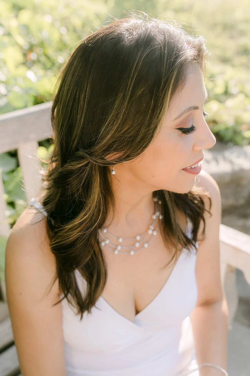 Portrait of Francesca in soft light beside the gazebo.