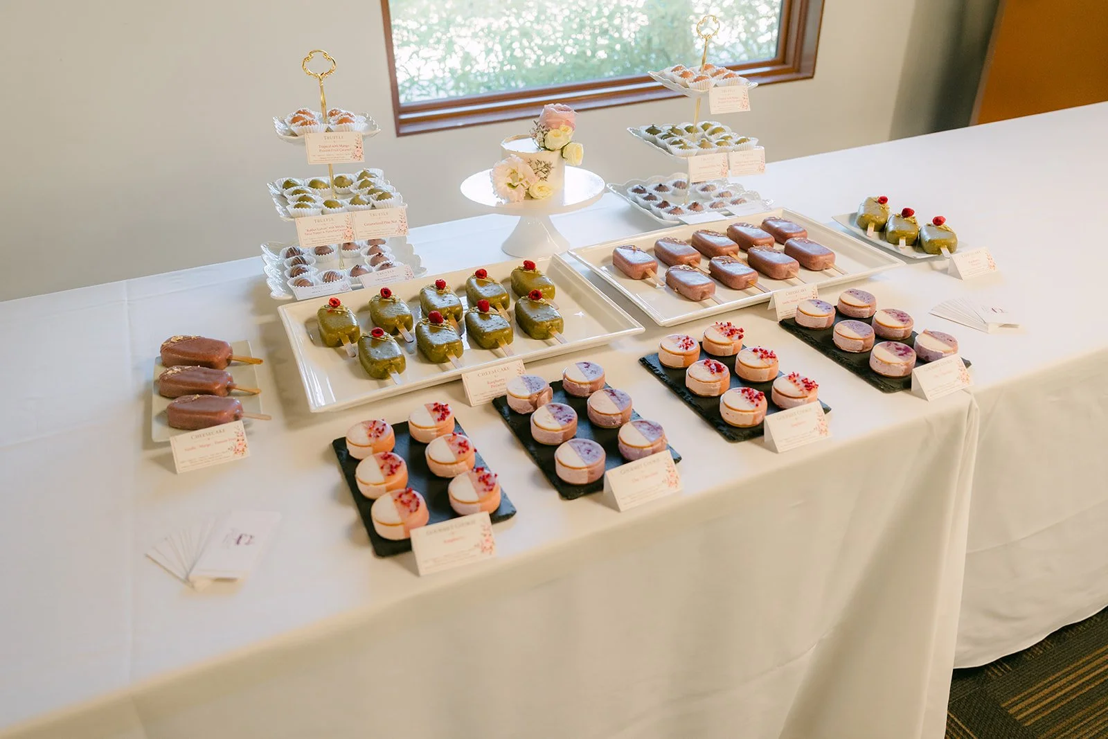 The dessert table filled with mochi and sweet treats.