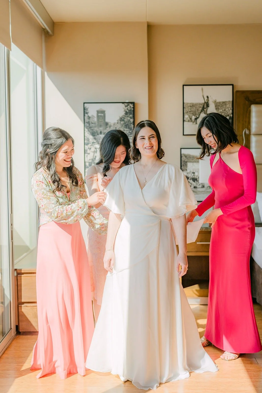 Jessie with her bridesmaids in shades of pink at the USC Hotel