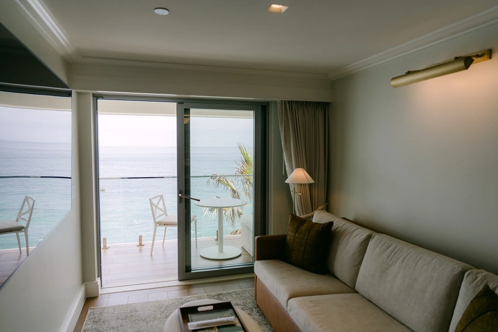 Mario's ocean view room at Surf & Sand Resort with the balcony doors open