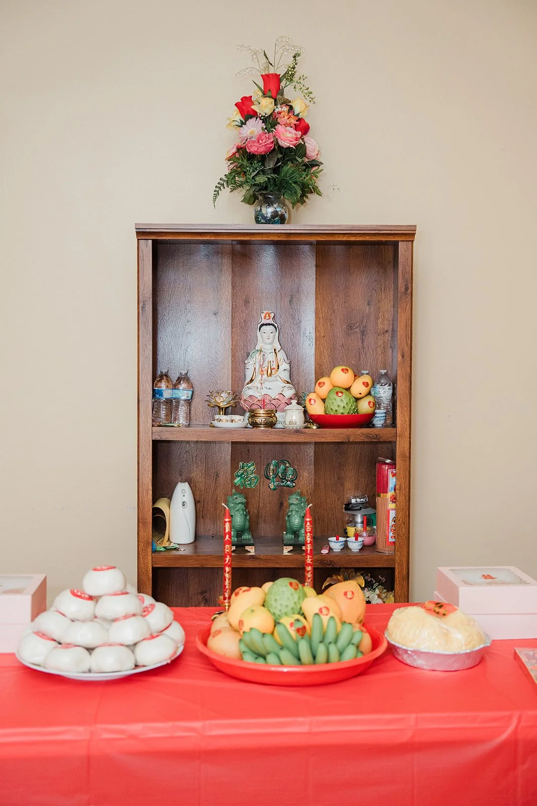 A family altar with offerings set up for the tea ceremony.