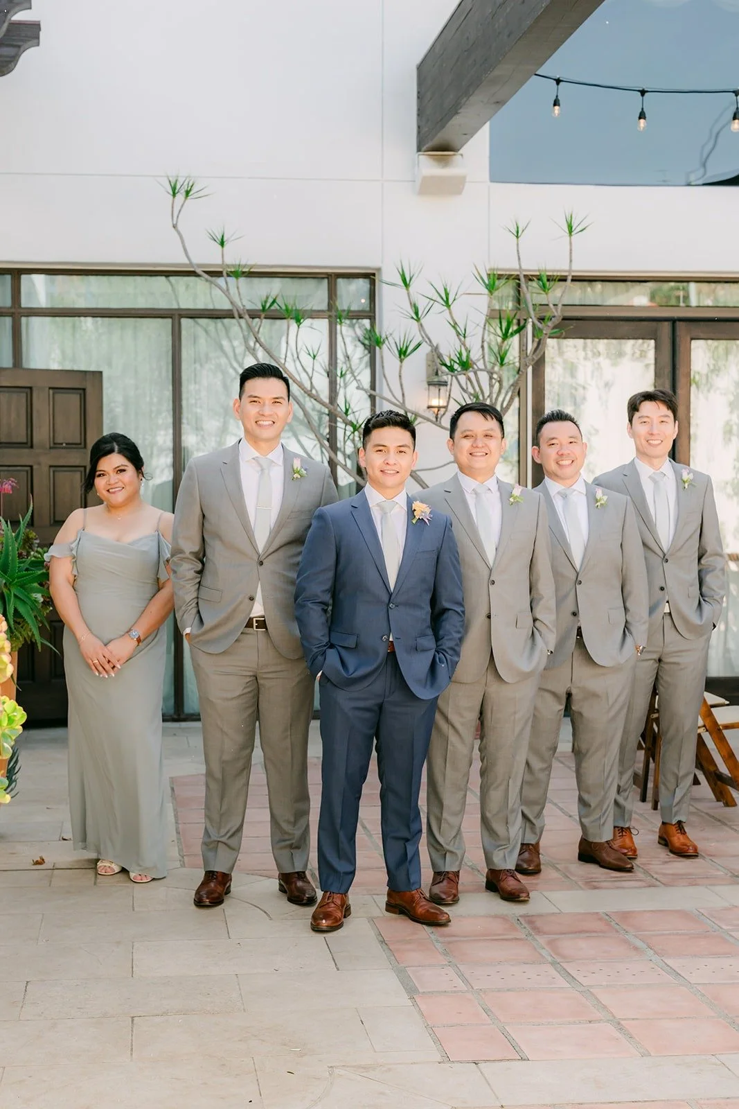 Jerrick and his groomsmen in the La Ventura courtyard, photographed by One and Only Production