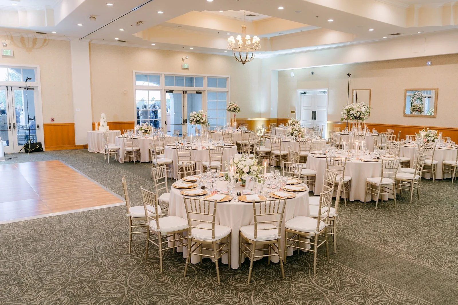 The Los Coyotes ballroom set with round tables and white linens