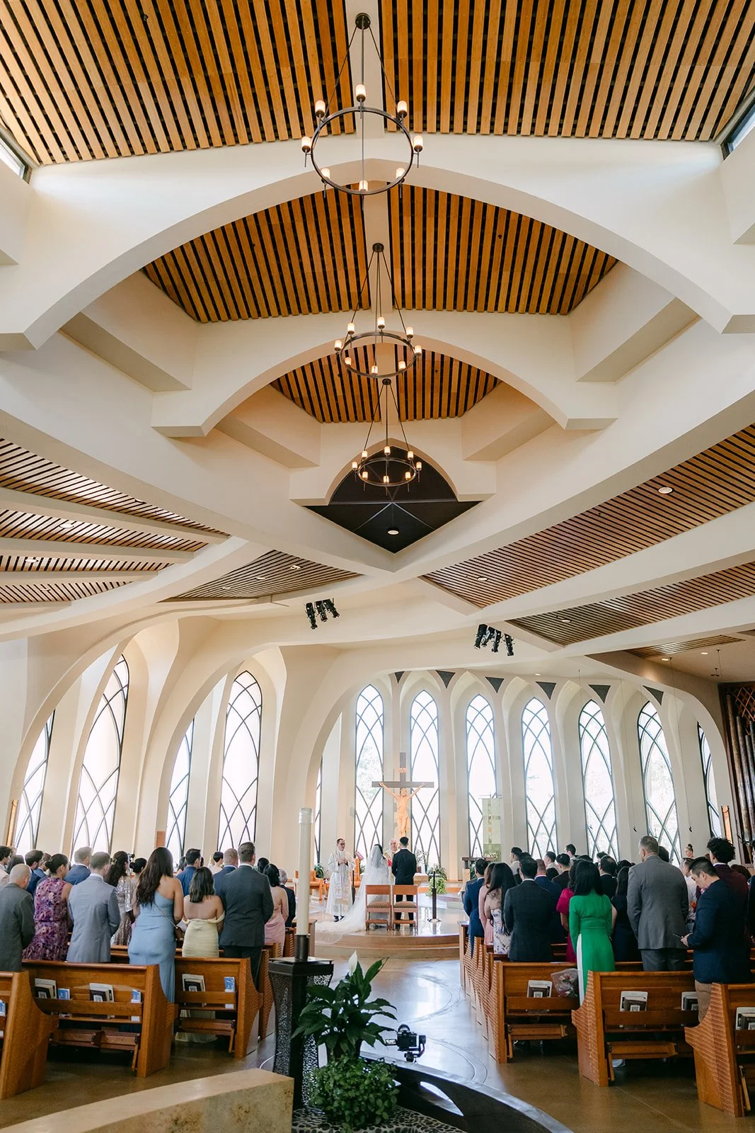 Wide view of the wedding mass at St. John Fisher Church