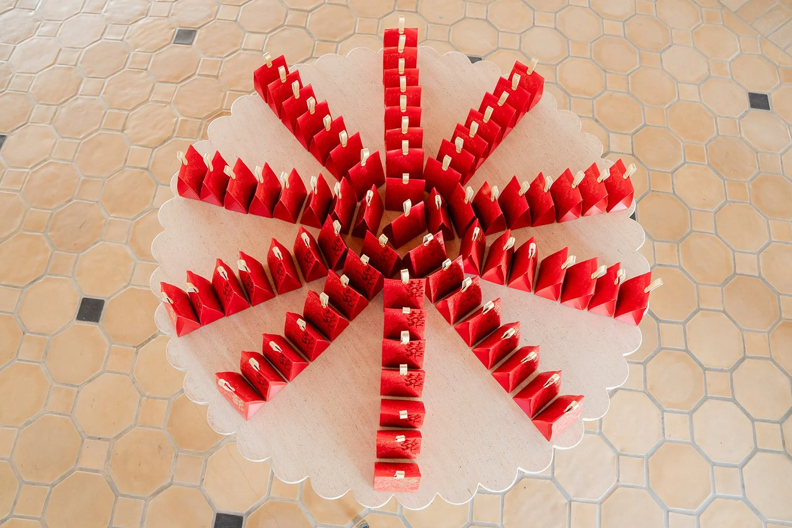 Red favor boxes arranged in a starburst