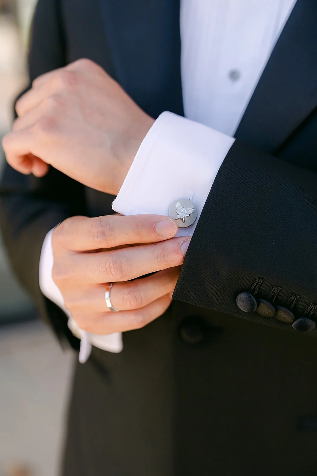 Vincent fastening his cufflink