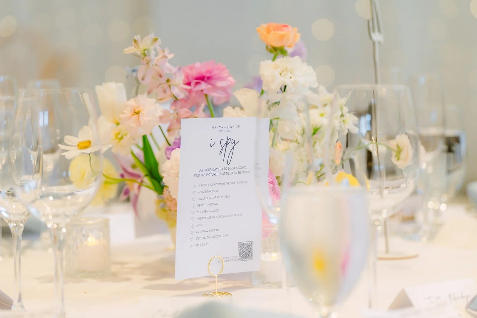 A table number among pastel florals and glassware