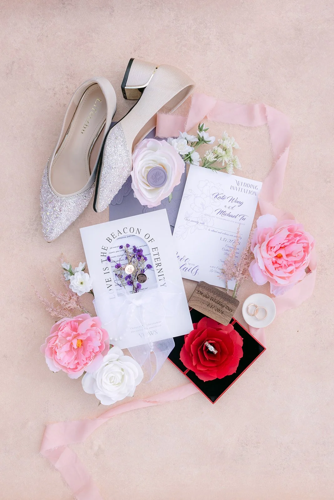 Kate's wedding details with sparkling heels, perfume, rings and pink roses.