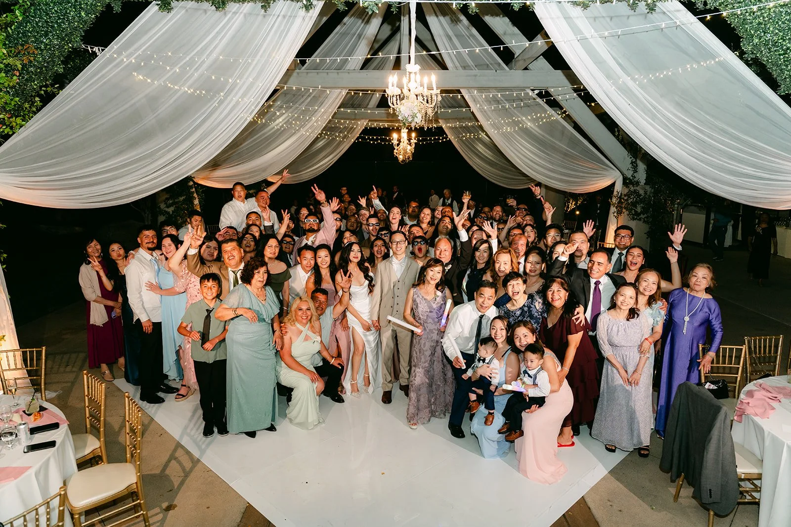 Group photo of every guest on the dance floor at Coyote Hills Golf Course.