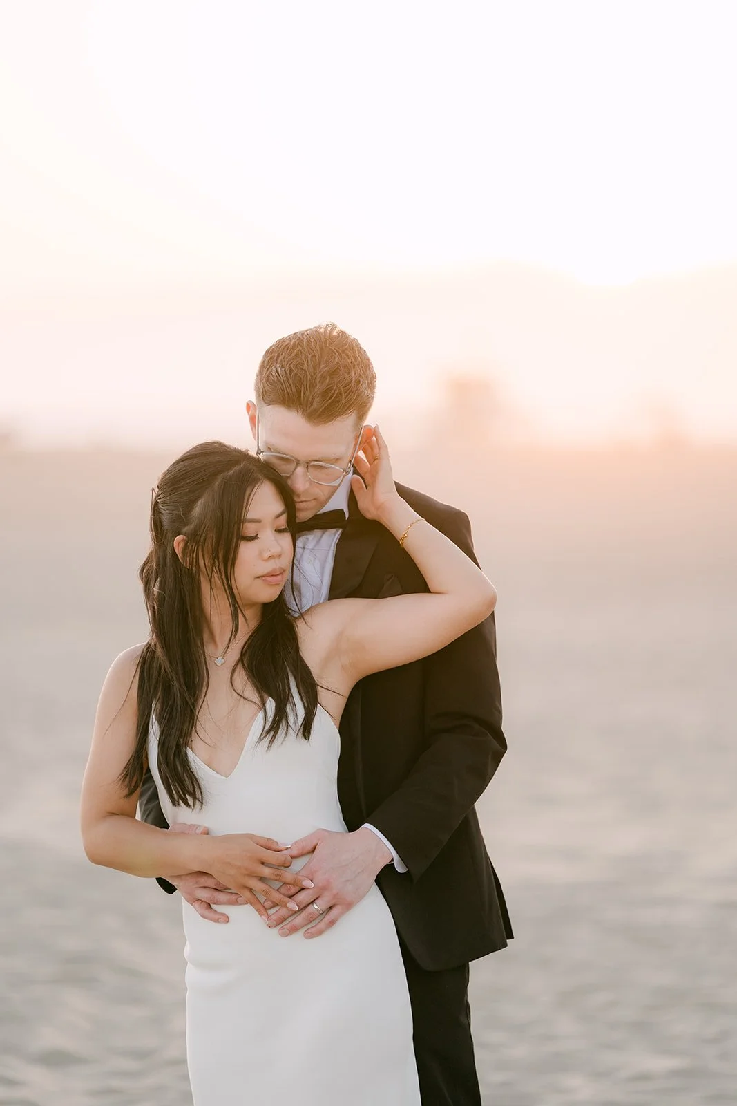 A soft embrace in the sunset haze