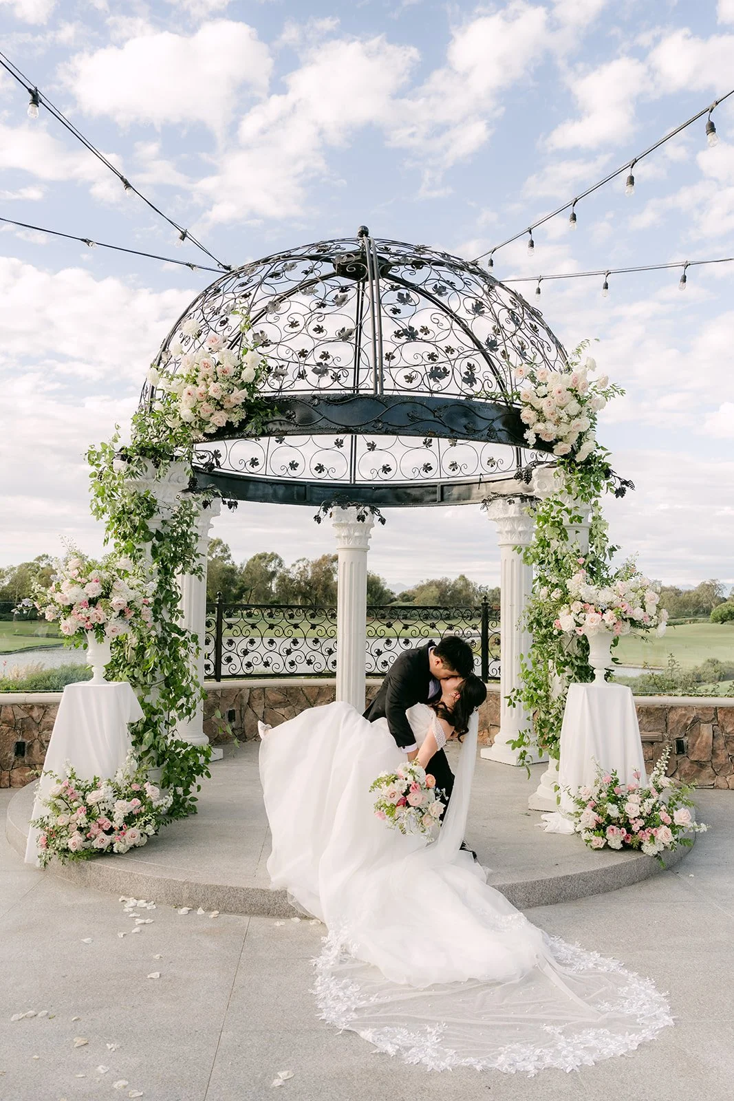 A kiss under the gazebo with Jessica's train spread out